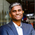 Person smiling at camera in suit