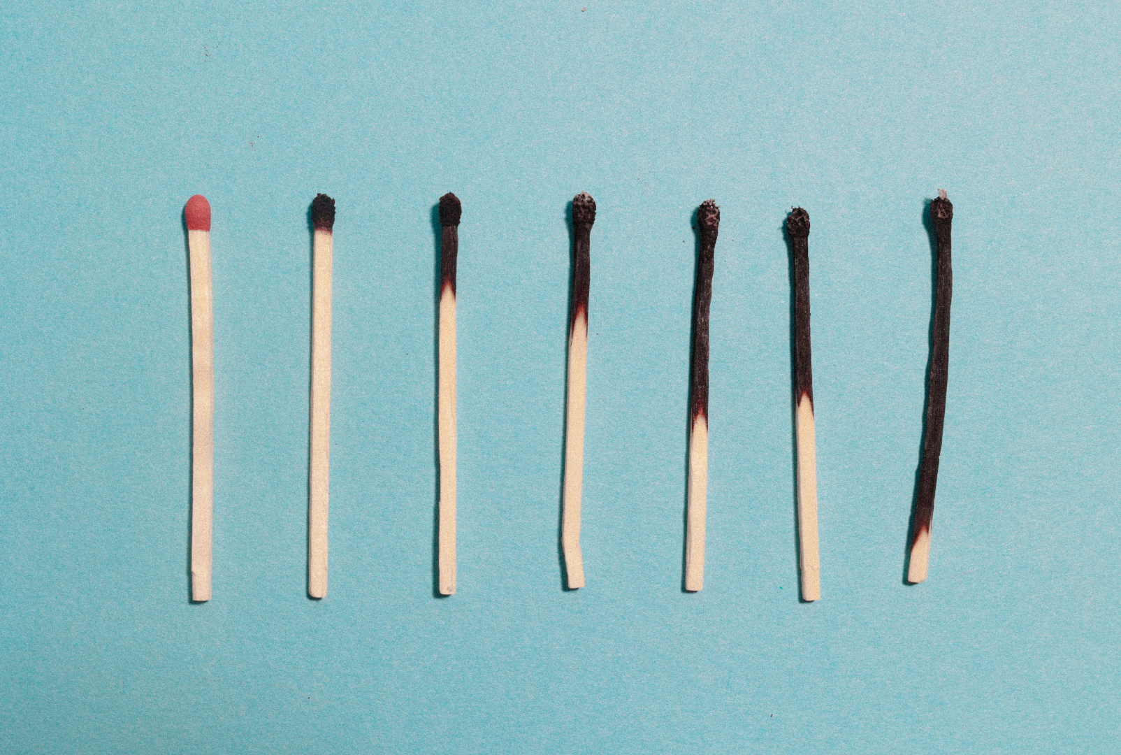 Matchsticks in progressive states of burning out