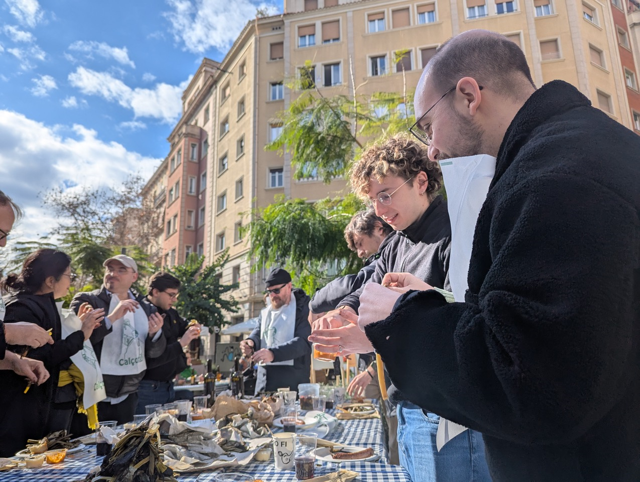 A group of people enjoying an open air city dining experience in Calcotada to celebrate the launch of RELISH