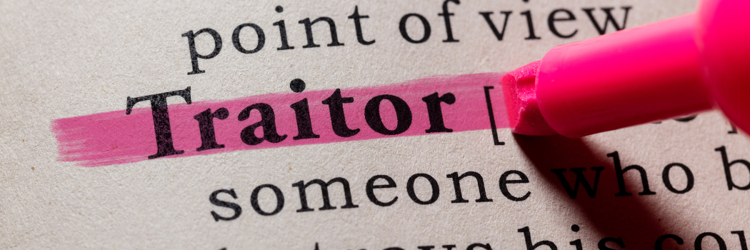 The word 'traitor' highlighted in a book.