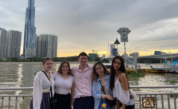 A group of students at a waterfront location