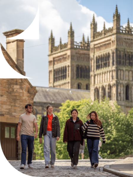 Students walking down Owengate with Cathedral in the background