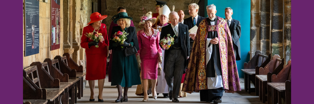 Six people in a row leaving Durham Cathedral. Includes the Queen, Dame Sue Snowdon, the King and the Dean of Durham