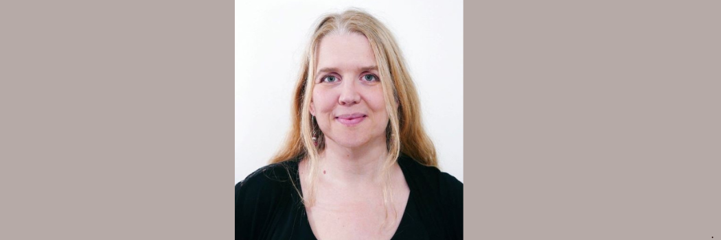 Professor Lynda Boothroyd smiling to camera, against a light background