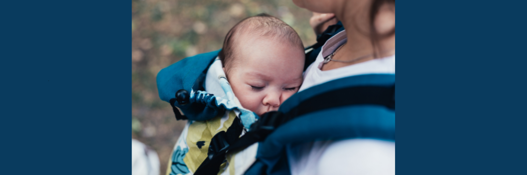 Baby asleep in a sling