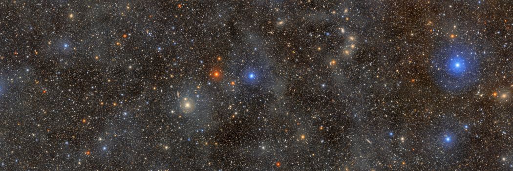 A field of stars set against a black background.