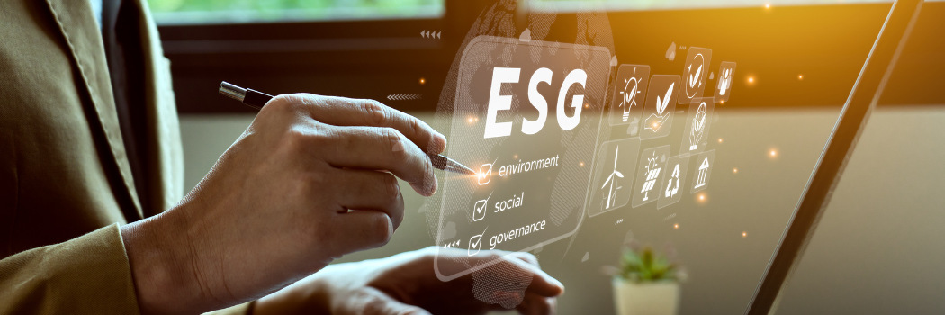 Businessman using a computer to analyse investment ESG