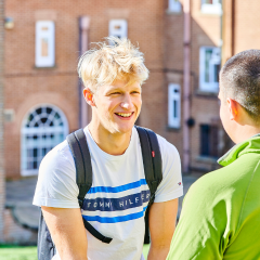 Two students sitting in front of Grey College