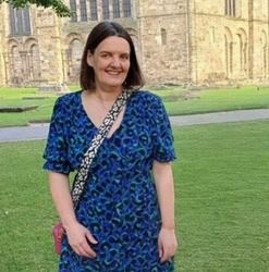 Lucy Bush in front of a building