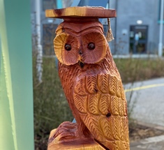 A picture of the South College Mascot, Oswald T Owl. Oswald is a wood carved owl.