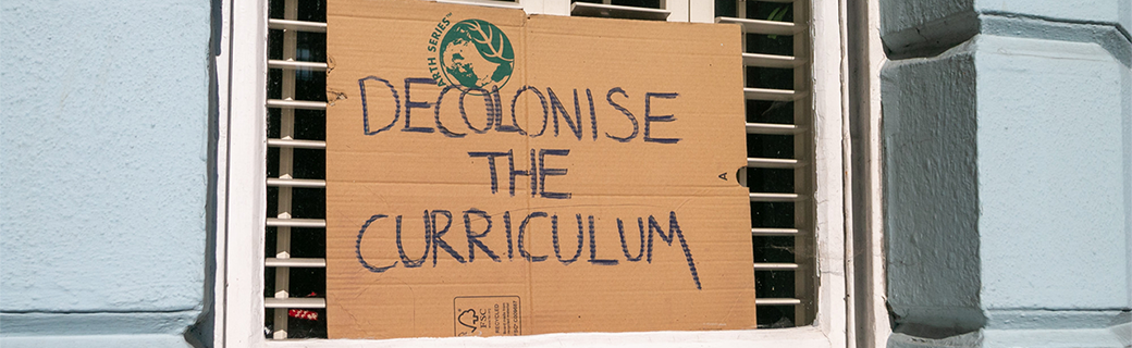 Decolonising the Curriculum sign in a window