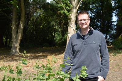 Prof Mike Church on a sunny day at the Botanic Garden, Durham University