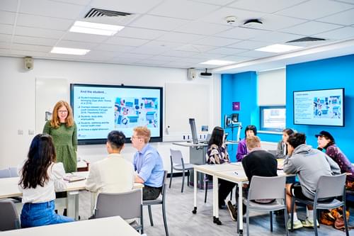 Students and tutor in a classroom