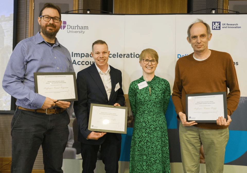 A group of people receiving an award