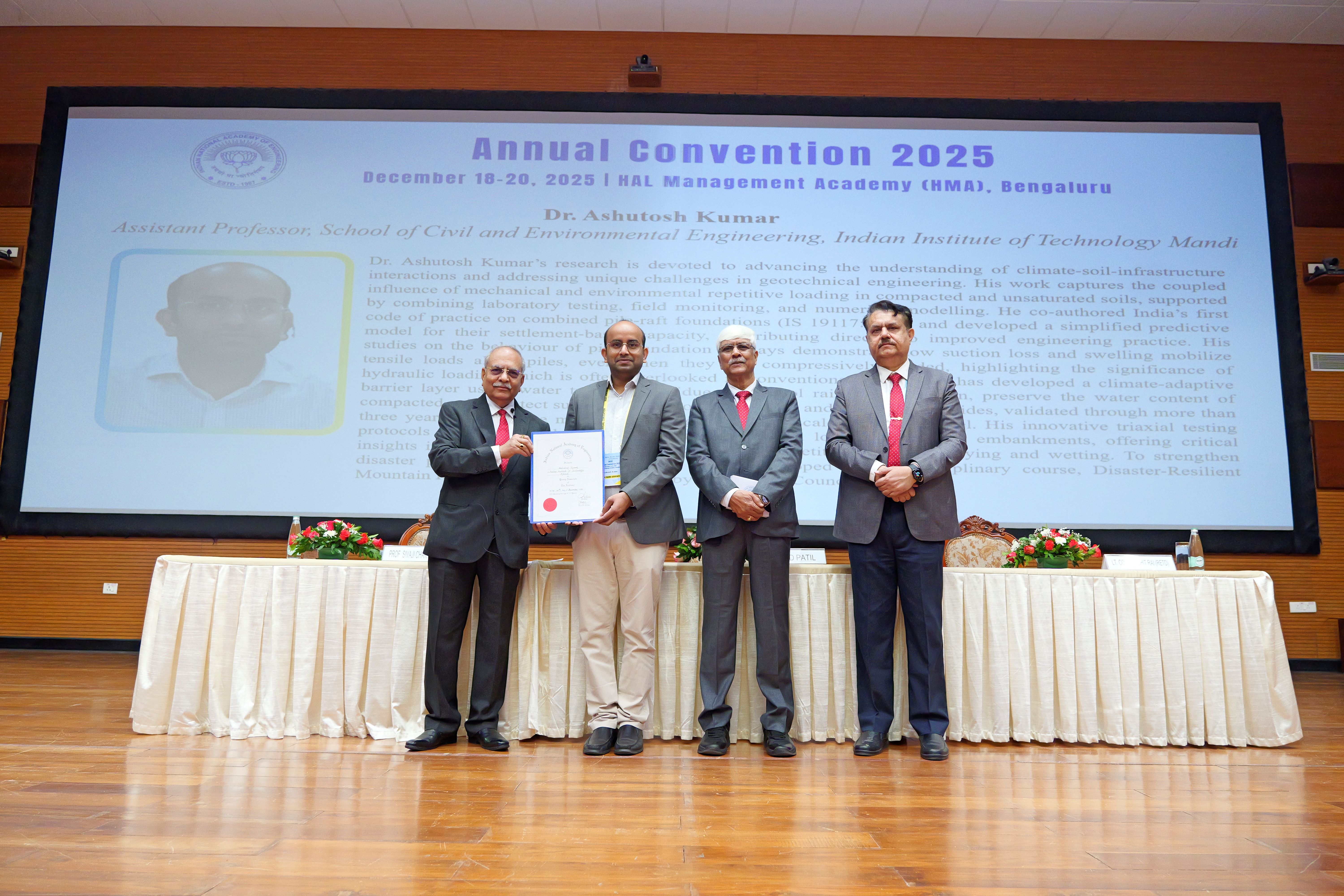 Dr Ashutosh Kumar being presented with his award