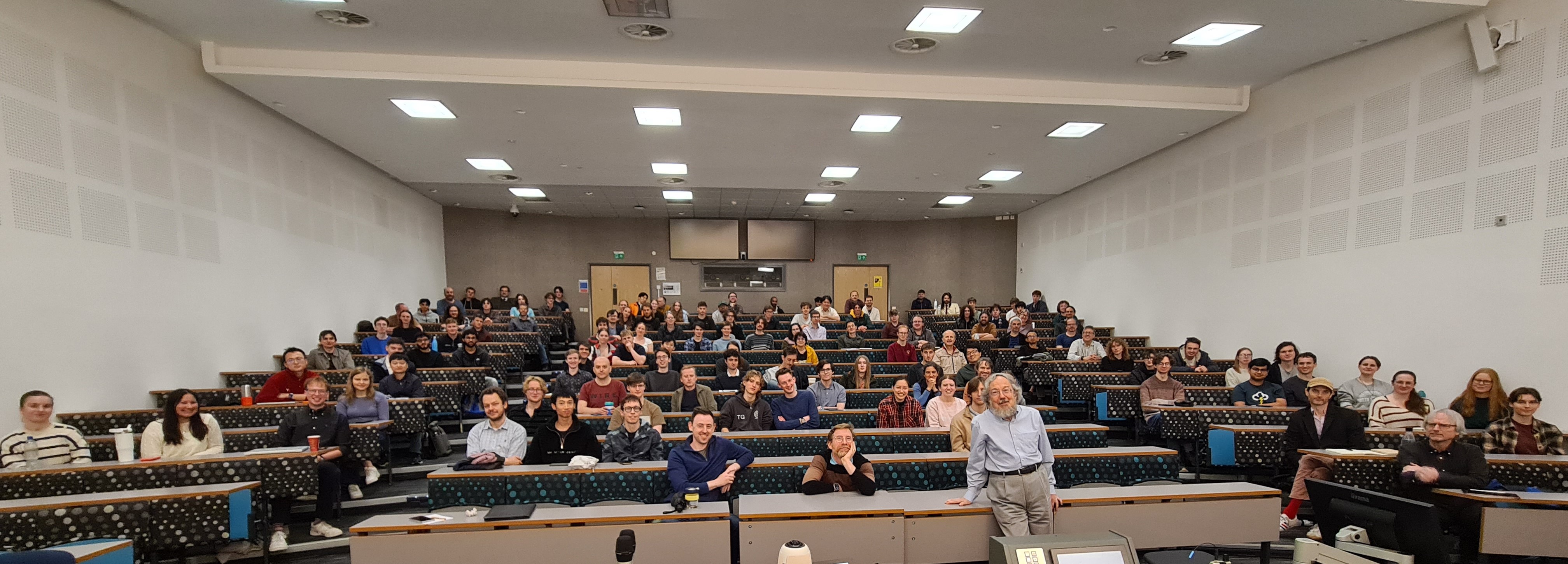 Panorama photo of audience and lecturer at Collingwood Lecture 2026
