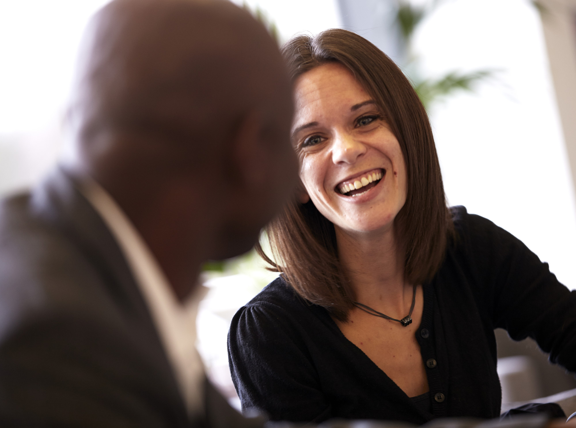 Woman smiling at a man