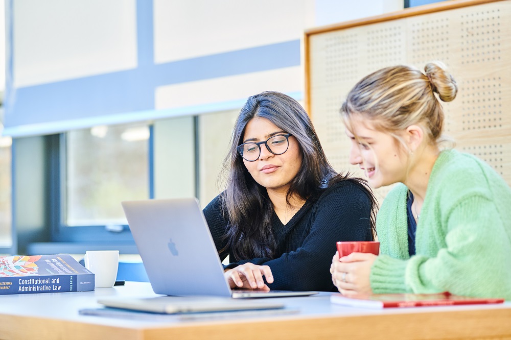 Students looking at Laptop