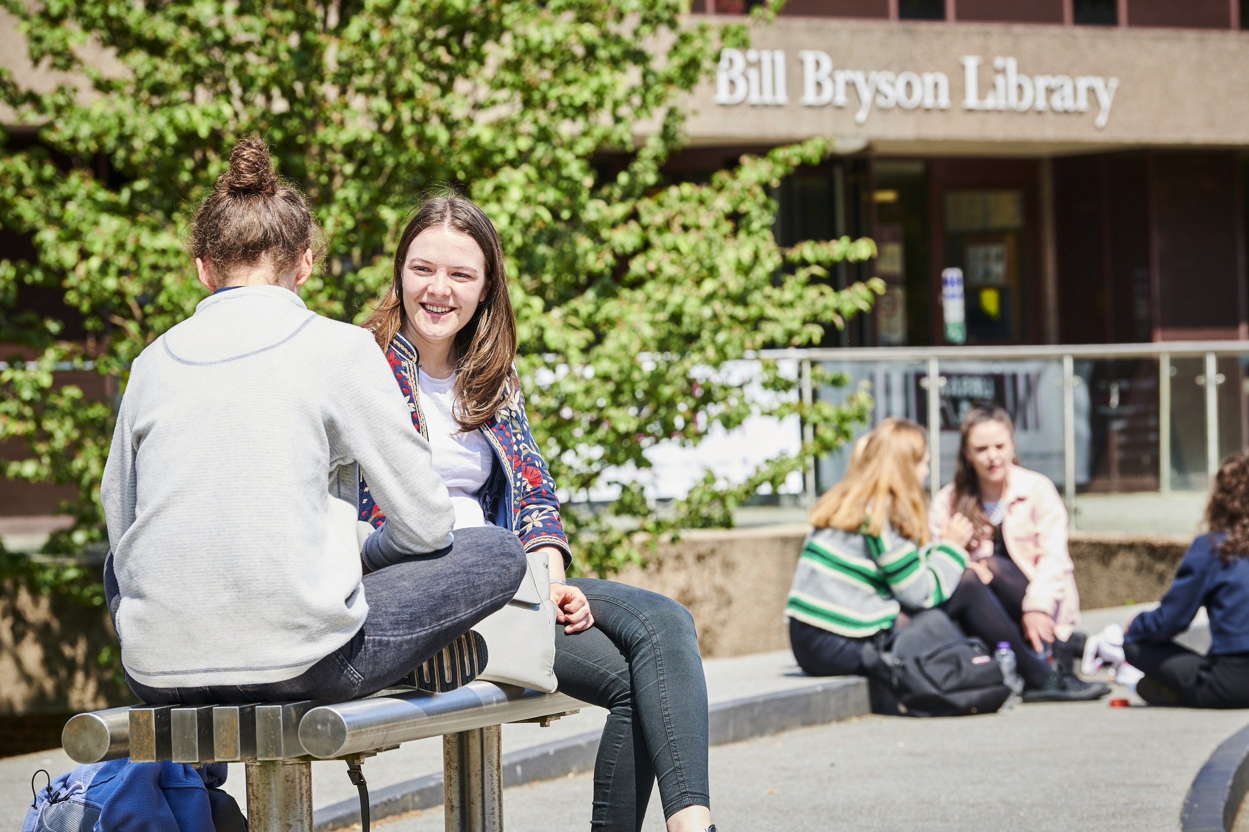 Two students talking outside of Billy Bryson Library