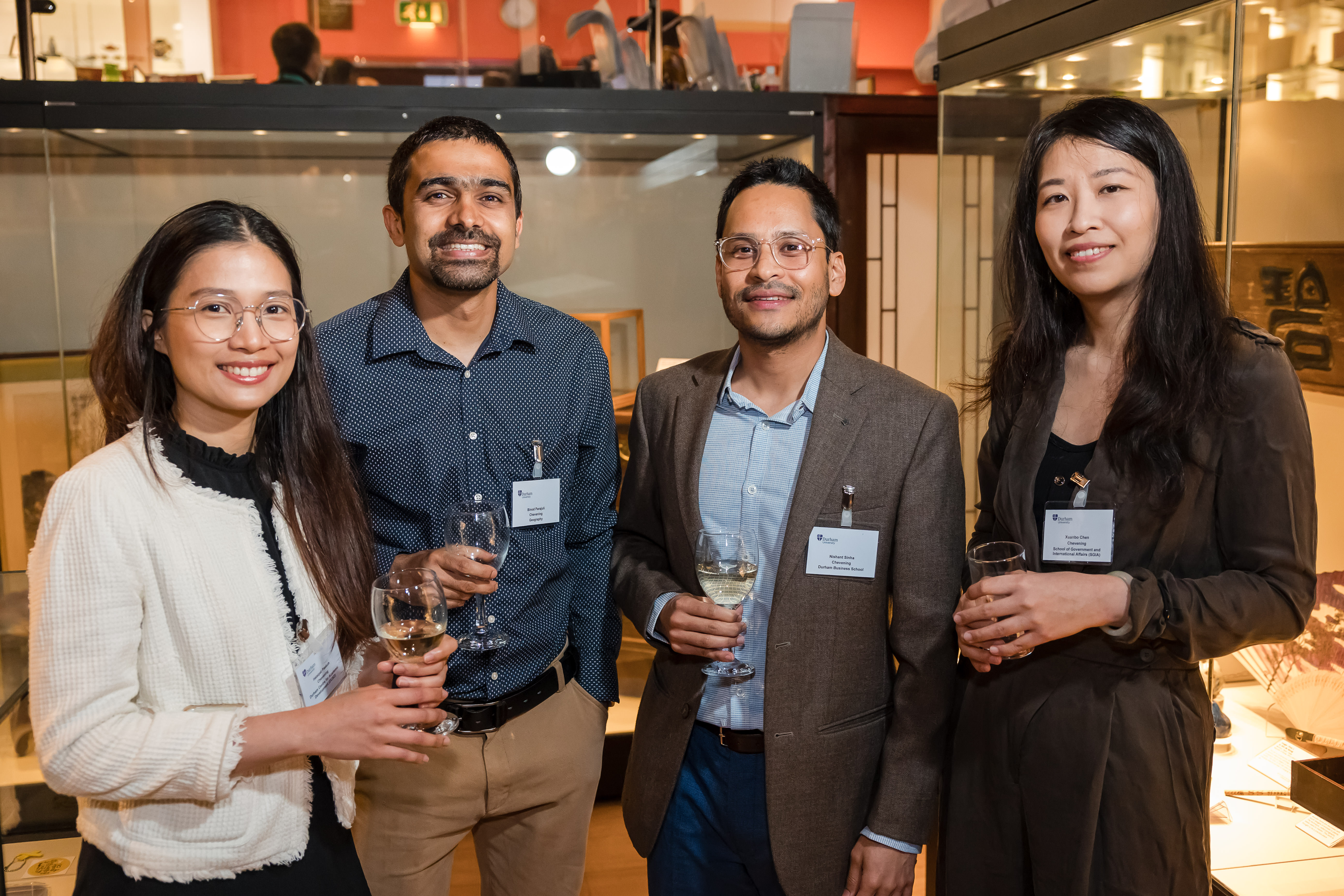 A group of four students socialising