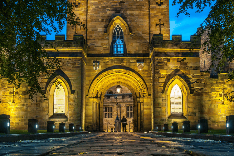 Durham Castle gatehouse at night