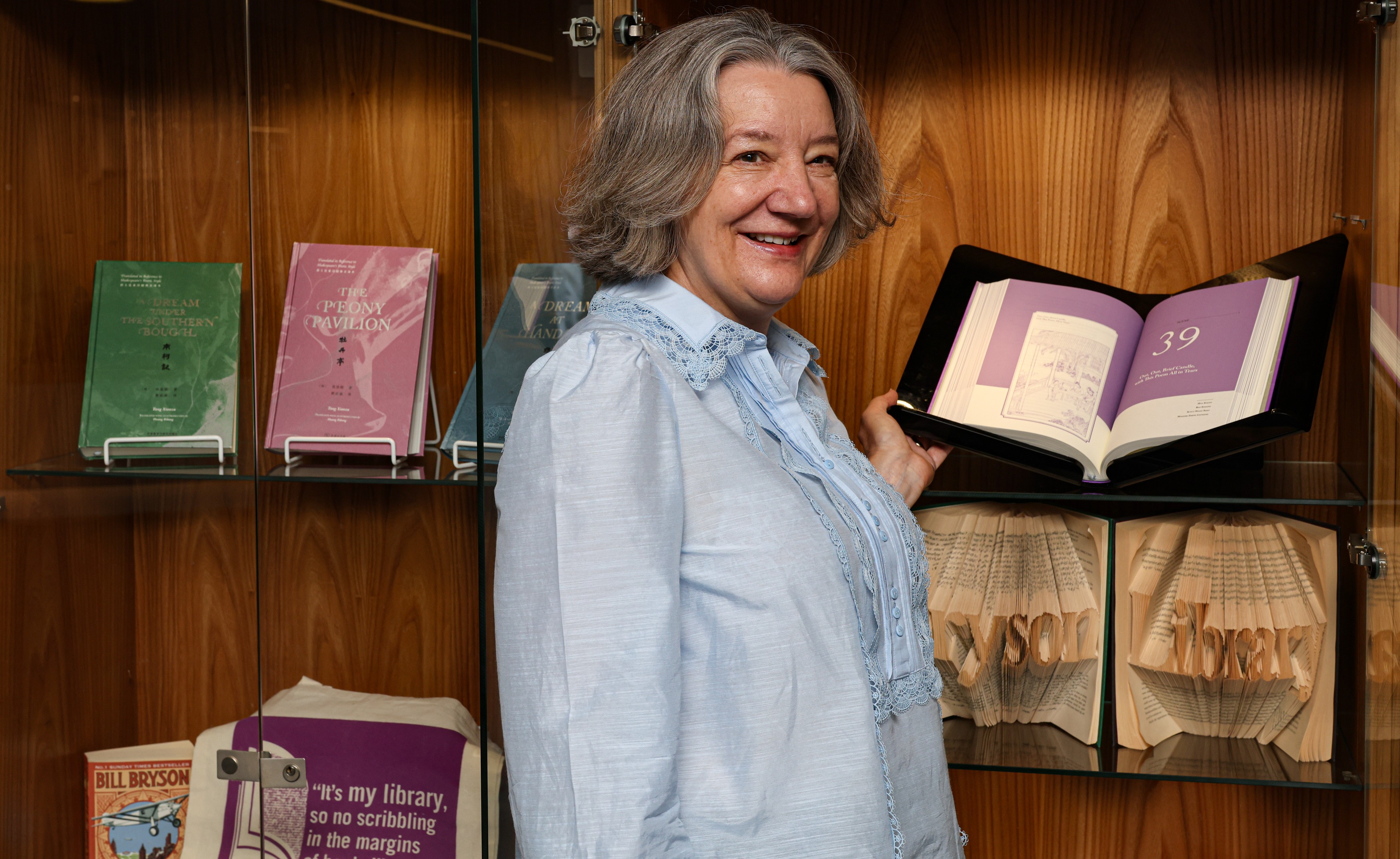 Vice-Chancellor Karen O'Brien with the books on display at Bill Bryson Library