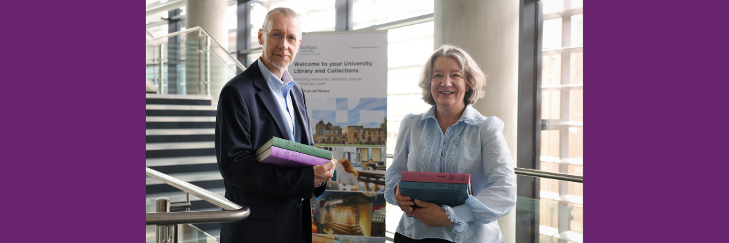 Stuart Hunt, Director of University Library and Collections, alongside Professor Karen O'Brien, receiving the books