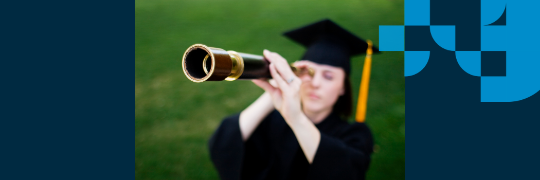 Graduate wearing a cap and gown looking into a telescope