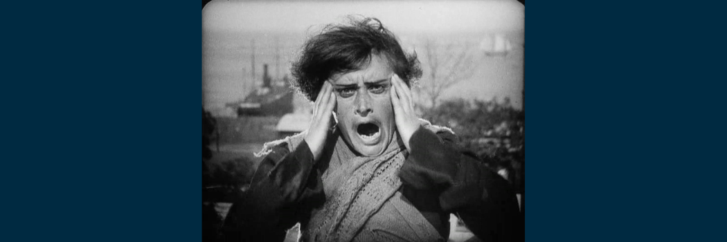 An image of a mother holding her head from silent film The Battleship Potemkin