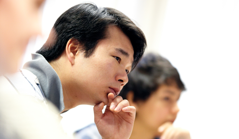A person listening intently during a seminar