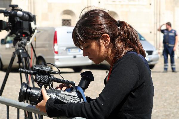 A female video journalist at work
