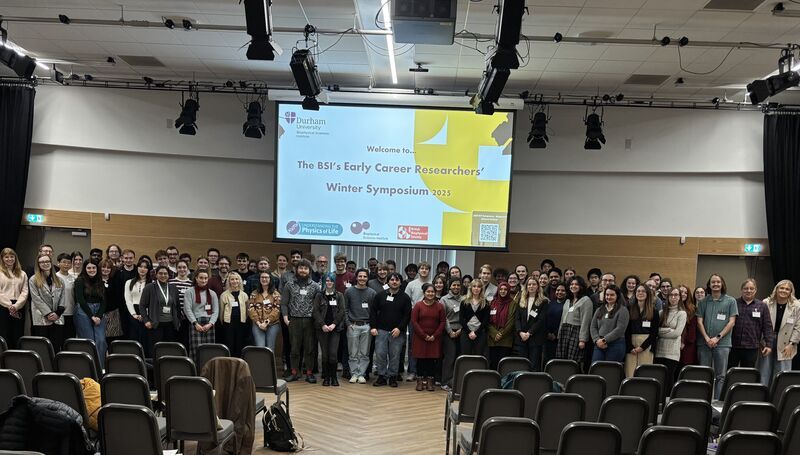 Attendees smile for the camera at the 2025 Winter Symposium