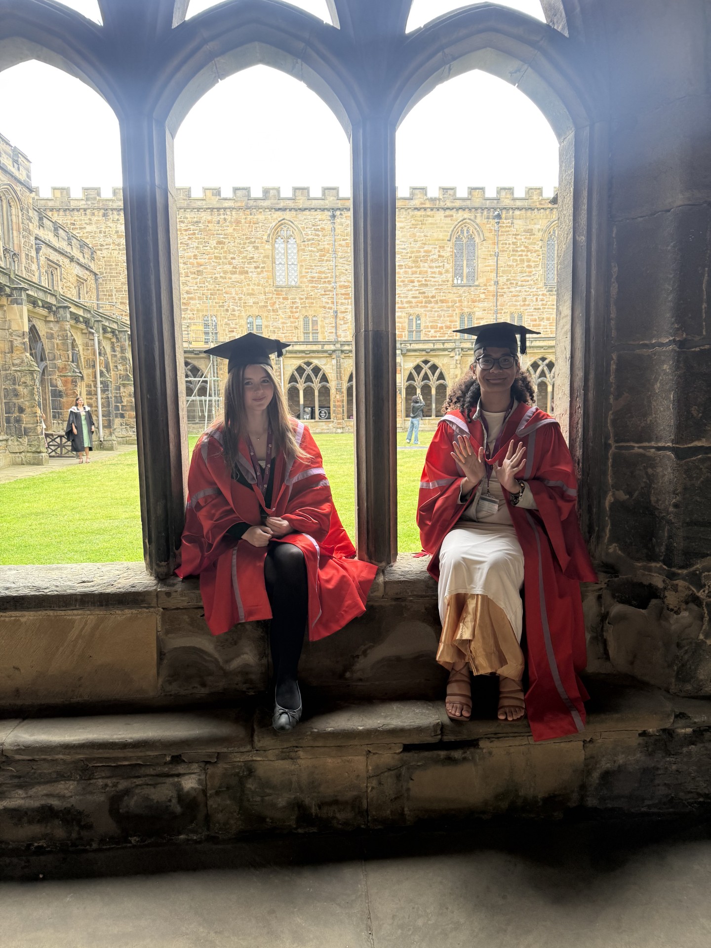 2 students in gowns
