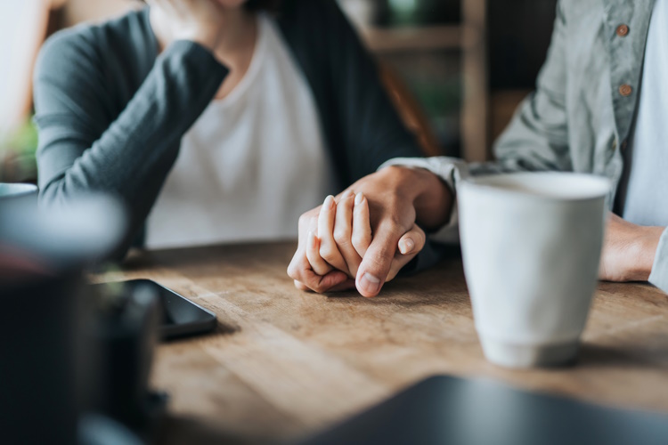 people holding hands - image courtesy of iStock