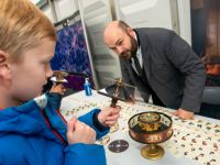 A boy looking at an exhibit