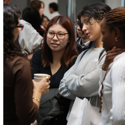 Students talking to employer