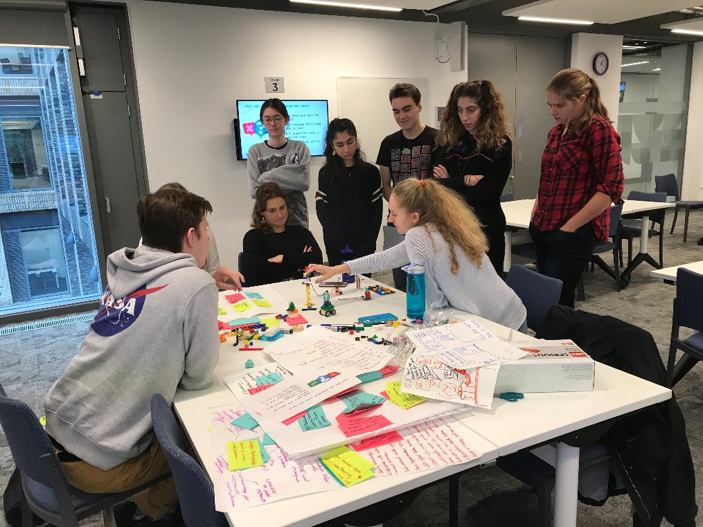 Students sitting around a table working together